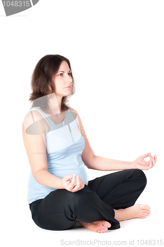 Image of Portrait of pretty pregnant woman practicing yoga