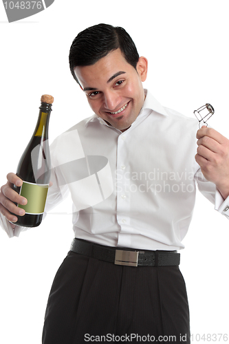 Image of Happy man with bottle of champagne