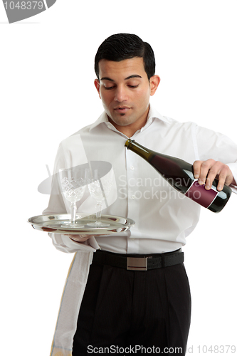 Image of Waiter or bartender pouring wine