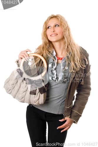 Image of Portrait of pretty young blonde with a handbag