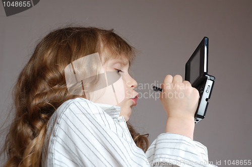 Image of child playing video game 