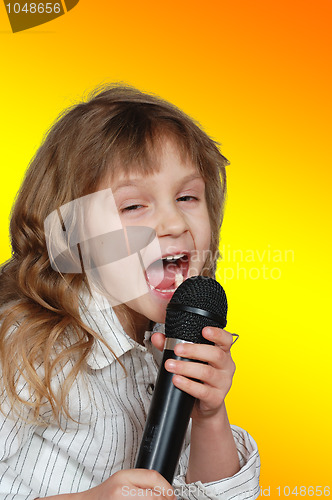 Image of singing kid with a microphone