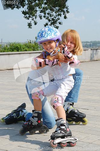 Image of family rollerblading