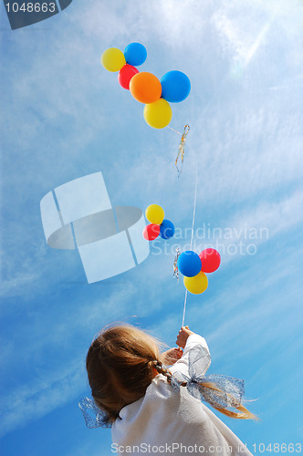 Image of child with balloons