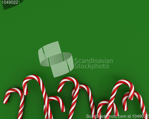 Image of Christmas candies on green background