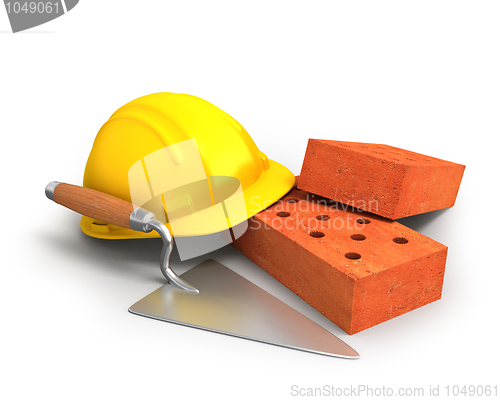 Image of Bricks, trowel and a yellow plastic helmet 