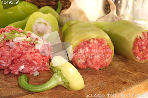 Image of raw stuffed peppers
