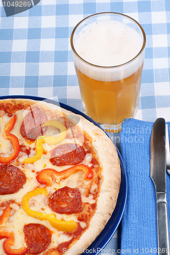 Image of Hot spicy pizza and beer