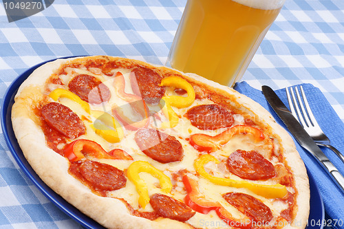 Image of Hot spicy pizza and beer