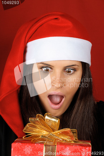 Image of Santa Claus girl with Christmas present