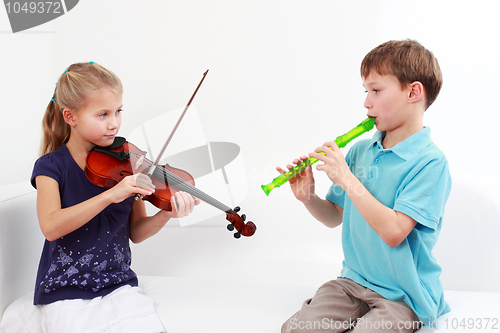 Image of Kids playing flute and violin