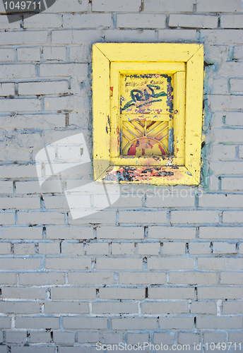 Image of White brick wall with old window