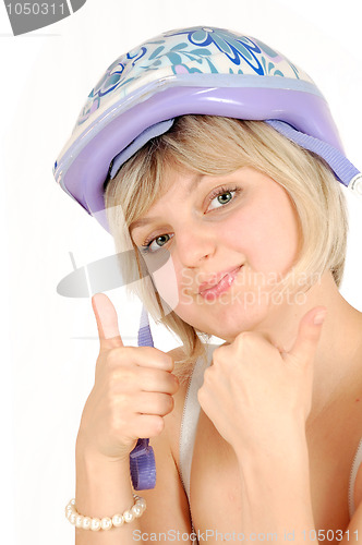 Image of beautiful blond girl with a helmet