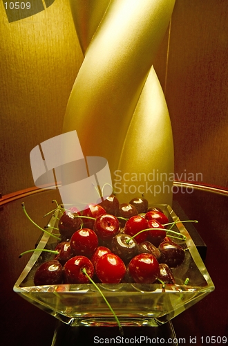 Image of Interior design element (faux cherries) in front of a lamp in an upscale hotel suite in Las Vegas (Mandalay Bay). They looked so real, I reached for one! (macro,14MP camera)