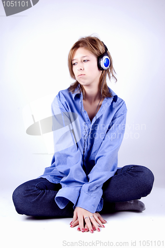 Image of Young girl in headphones   