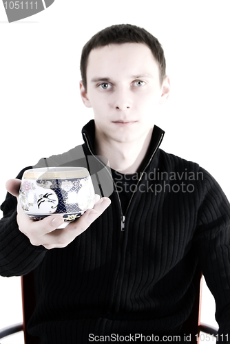 Image of young man with a cup of tea 