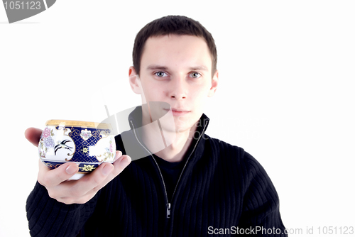 Image of young man with a cup of tea 