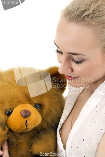 Image of Young woman with teddy bear  
