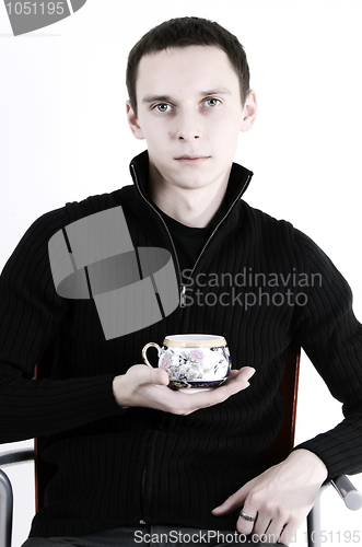 Image of young man with a cup of tea 