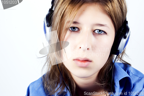 Image of Young girl in headphones   