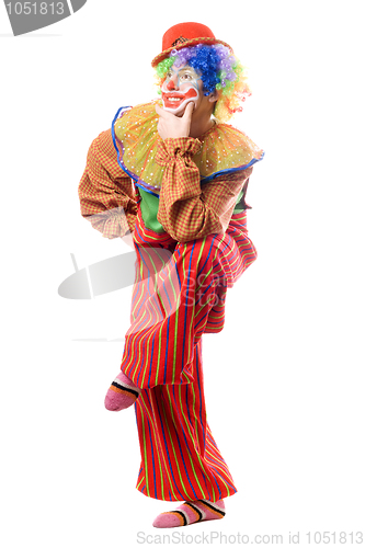 Image of Funny clown standing on one leg