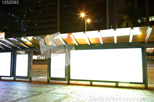 Image of Blank billboard on bus stop at night