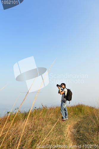 Image of Photographer taking photo outdoor