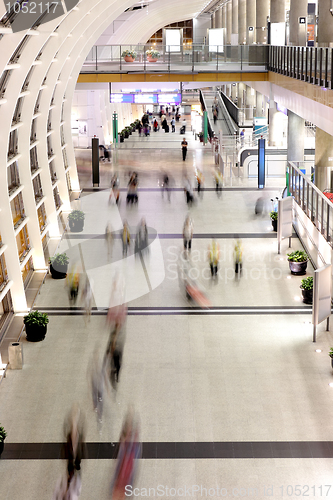 Image of people moving blur in corridor