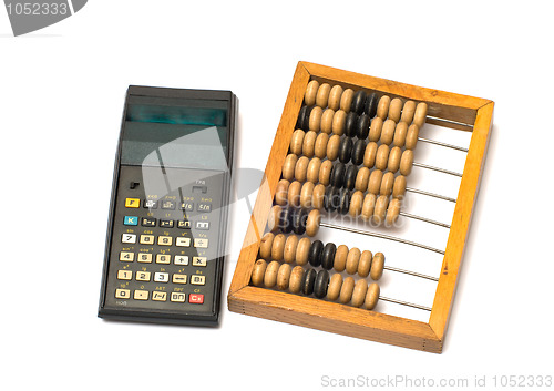 Image of Calculator and wooden abacus.