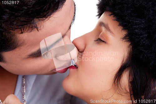 Image of close up, portrait of young couple kissing