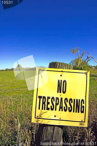 Image of A 'NO TRESPASSING' sign fronts farmland in this autumn country landscape.(14MP camera)