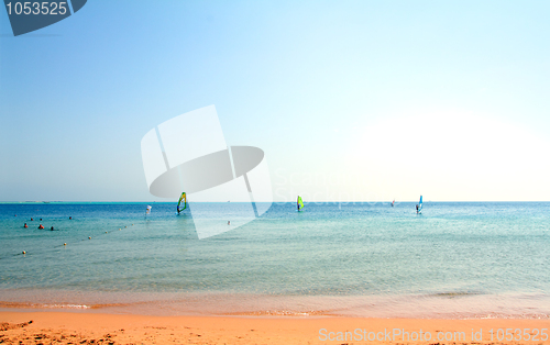 Image of landscape with beach and surfing