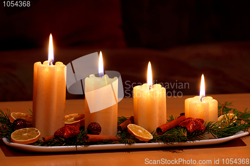 Image of Christmas decorated table with lighting candles