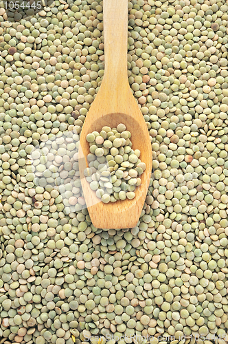 Image of Wooden spoon and dried green lentils