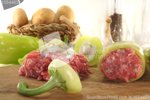 Image of raw stuffed peppers