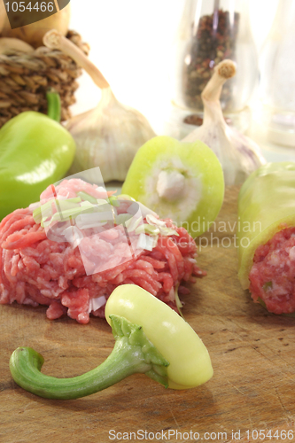 Image of raw stuffed peppers