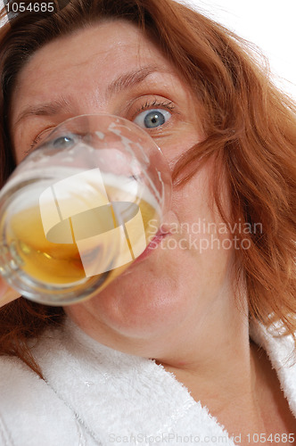 Image of woman drinking beer