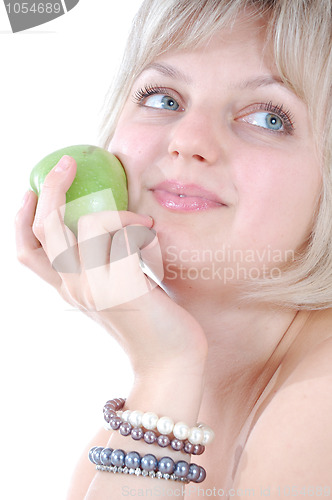 Image of beautiful blond woman with an apple