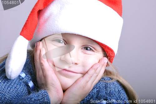 Image of cute little smiling Santa girl