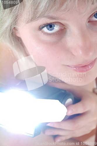 Image of beautiful blond woman with a flash