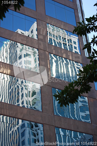 Image of Office building reflecting in another building window