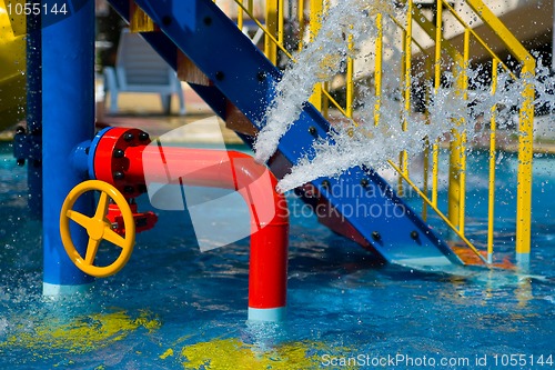 Image of Red iron tube in pool