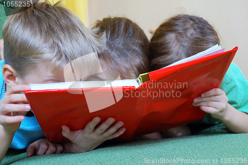 Image of children reading a book