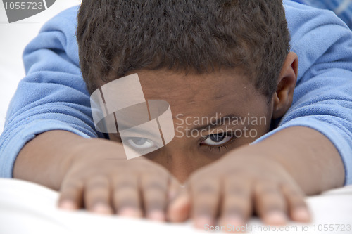 Image of Boy resting in his bed