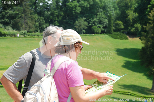 Image of senior couple tourists with map