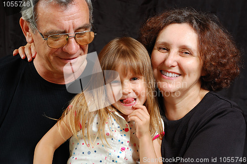 Image of grandparents with their granddaughter