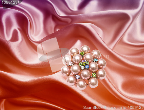 Image of Brooch closeup on silk background