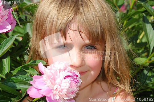 Image of child and flower