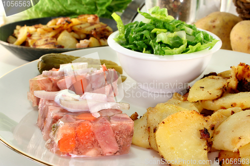 Image of Fried potatoes with meat jelly