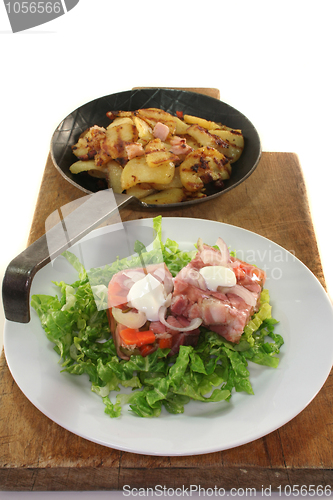 Image of Fried potatoes with meat jelly